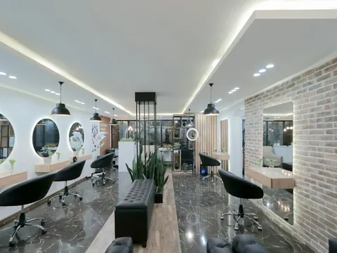 Styling chairs and round mirrors in a hair salon.